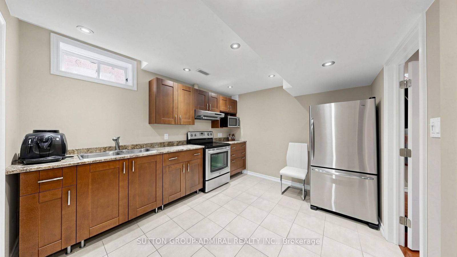 Lower-level second kitchen with full-size stainless appliances